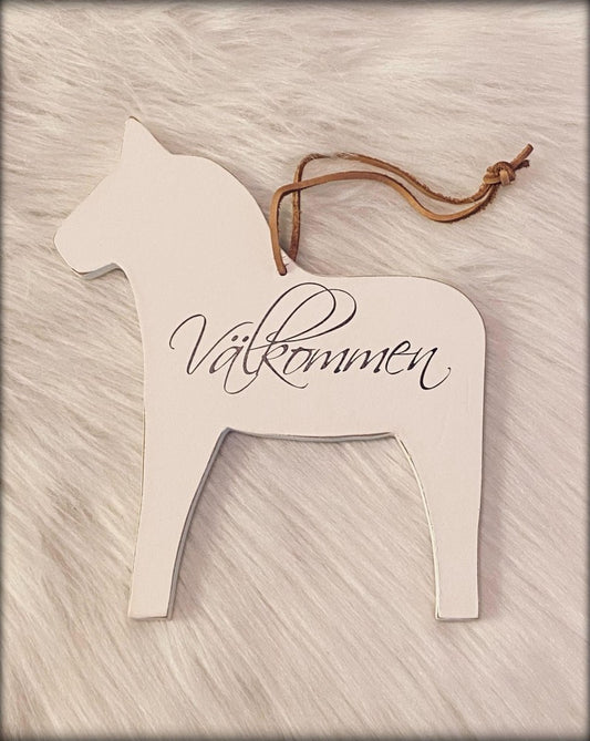 Skylt "Välkommen"